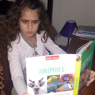 Anastasia reading more about animals.jpg