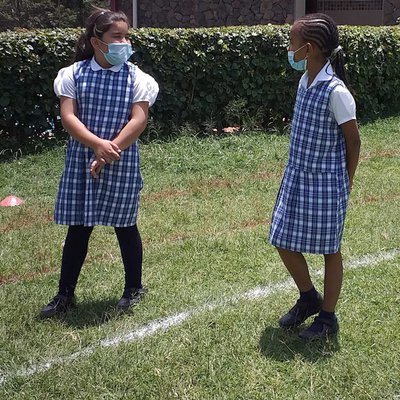 Manahil and Angel taking a walk in the school field..jpg