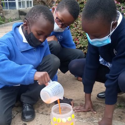 Njamba, Maya and Brook measure liquid into a jar..jpg