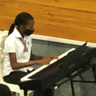 Wavinya showcasing her piano playing skills during our assembly.jpg