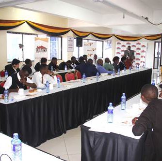 David Nyamu, General Manager, Corporate Banking takes the scholars through the Equity Journey during the study tour at Equity Centre.